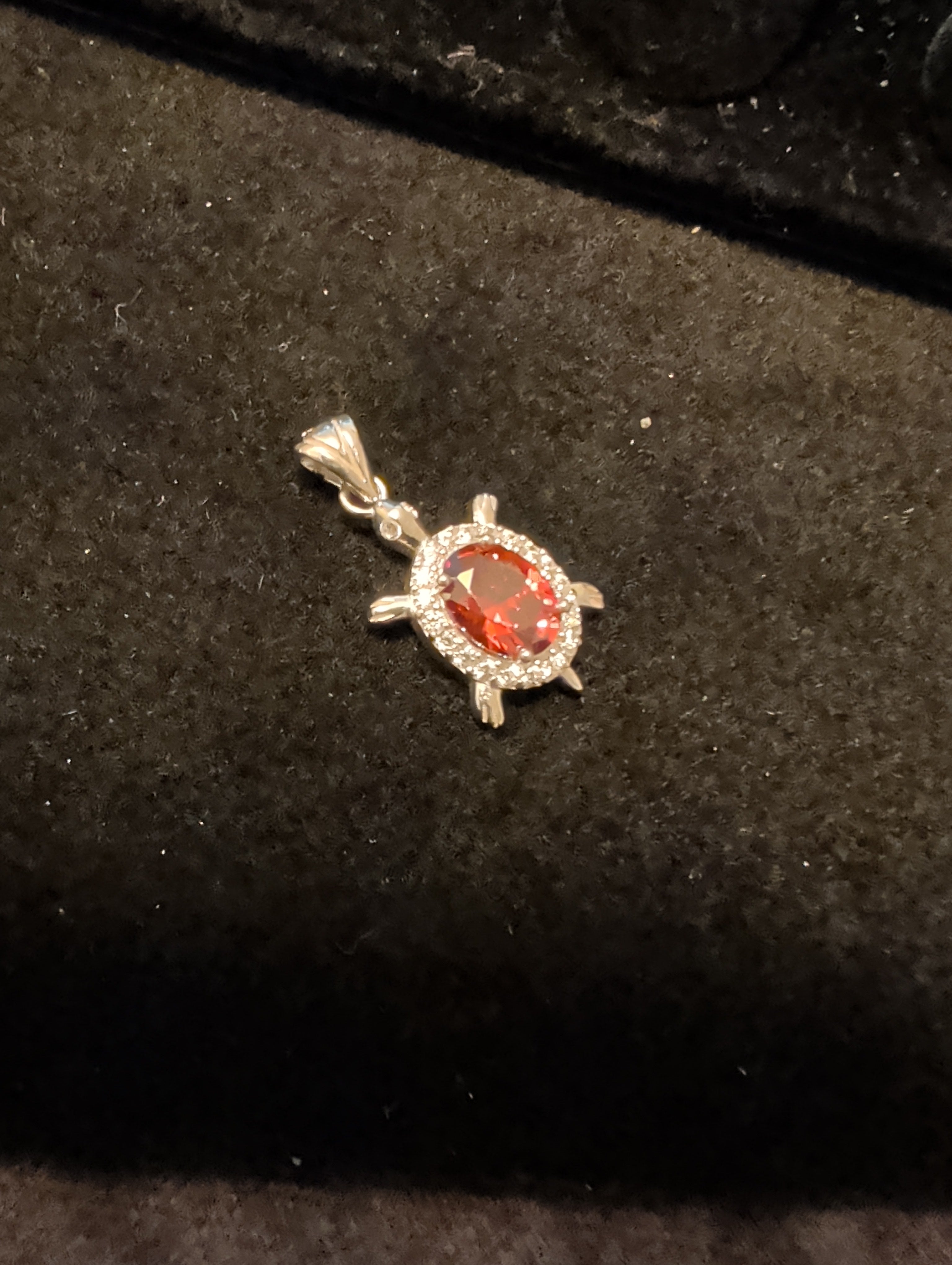Turtle pendant. Red is cubic zerconia. Outer ring moissanite.