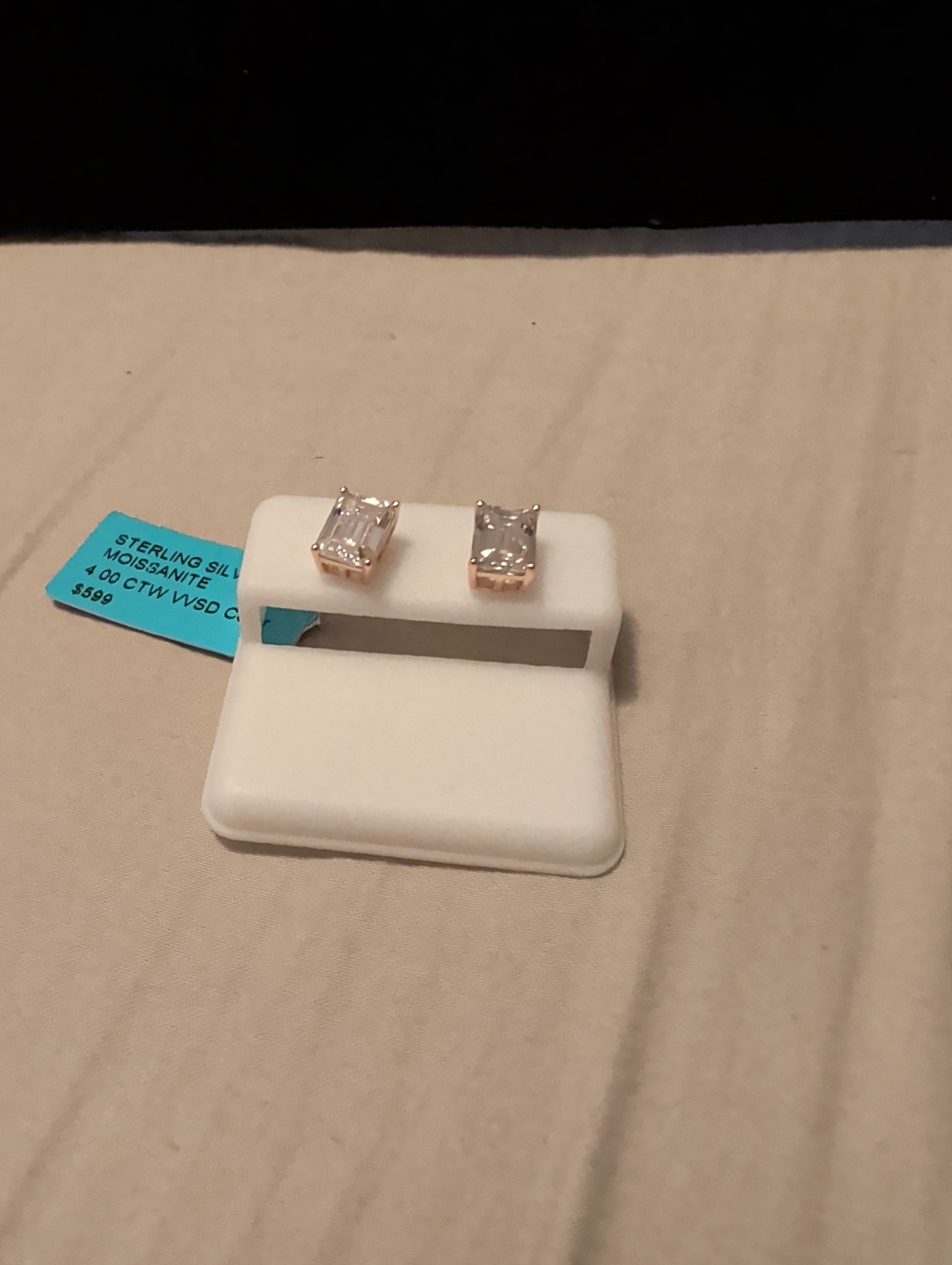 4ctw moissanite earrings. Between the two.