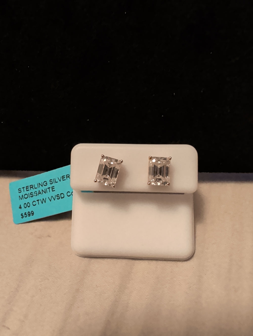 4ctw moissanite earrings. Between the two.